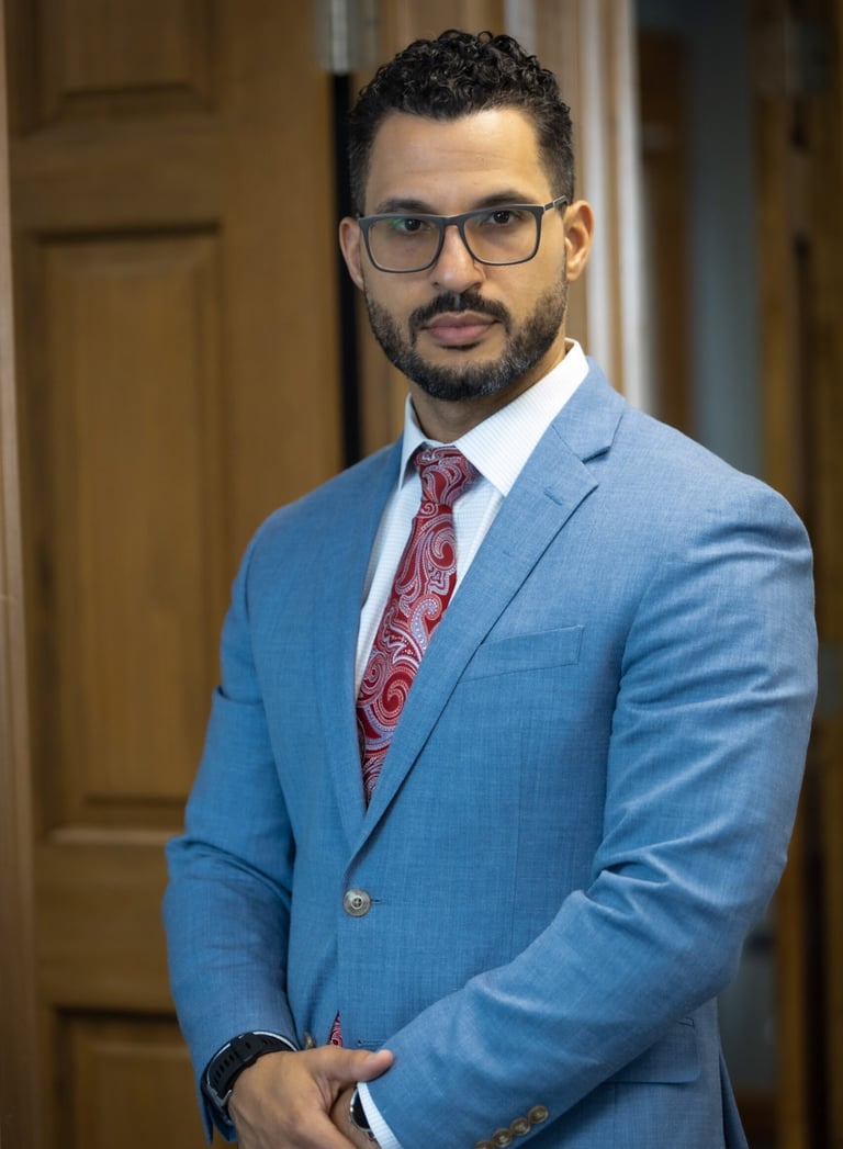a man in a blue suit and red tie