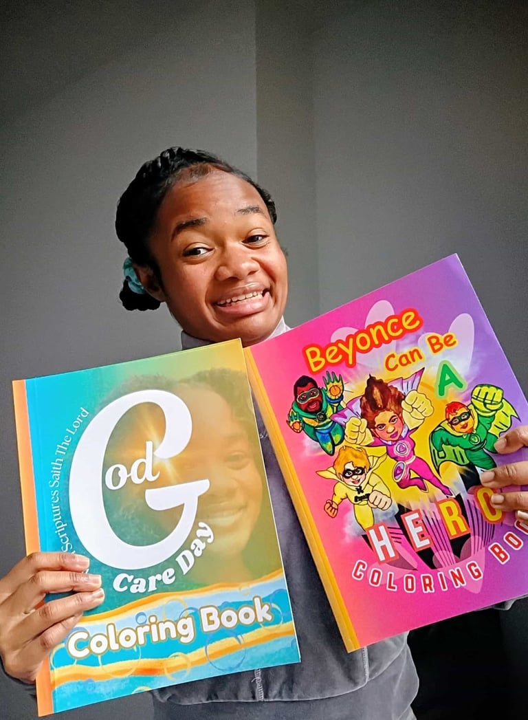 A smiling woman holds two colorful children's coloring books featuring inspirational and superhero themes.