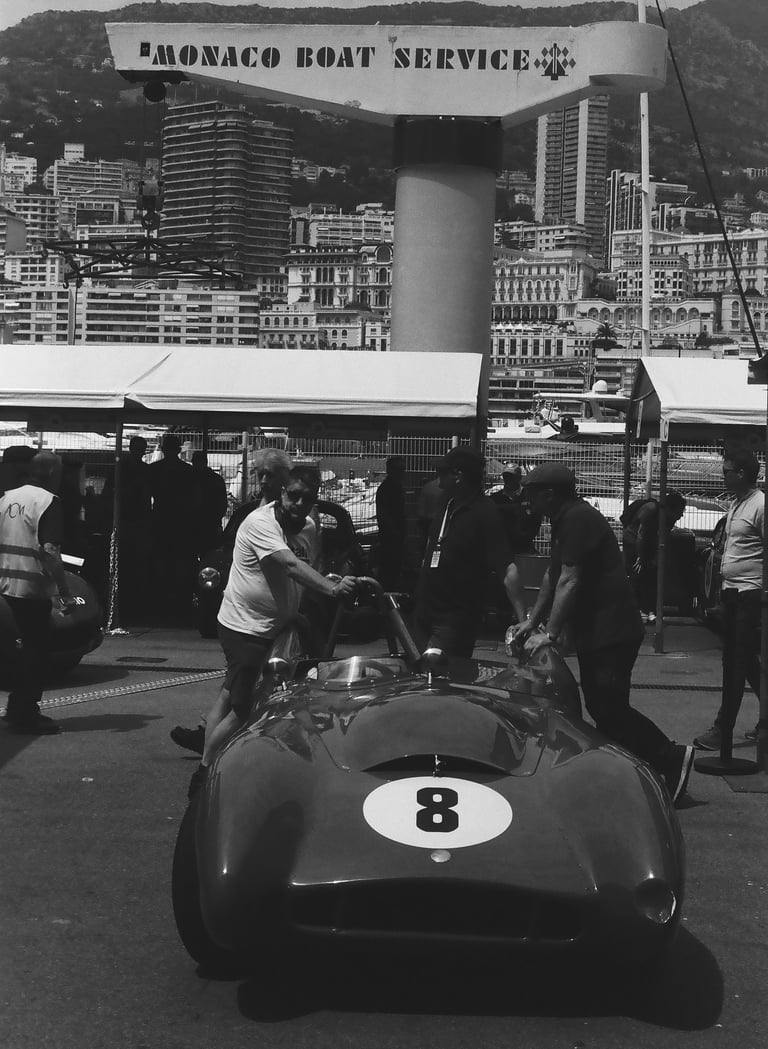 a race car parked in the paddock