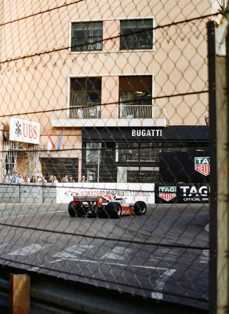 80's Formula 1 car going through La Rascasse corner in Monaco