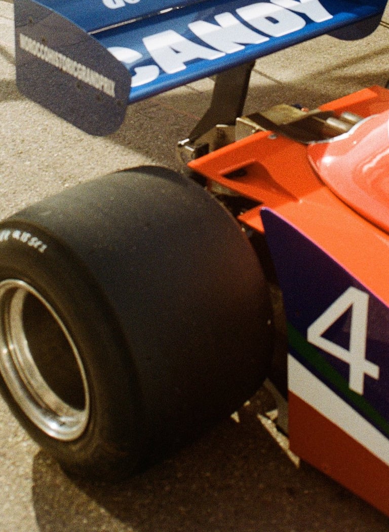 a race car parked in the paddock