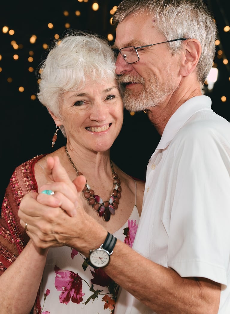 a man and woman dancing at a wedding party