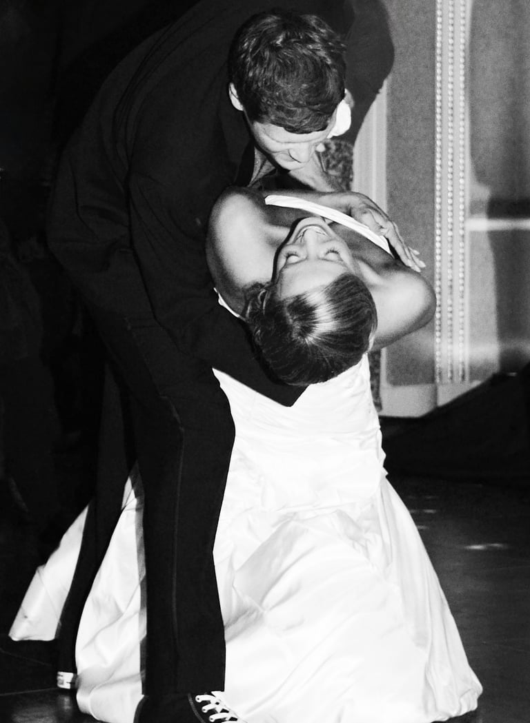 a bride and groom dancing at a wedding reception