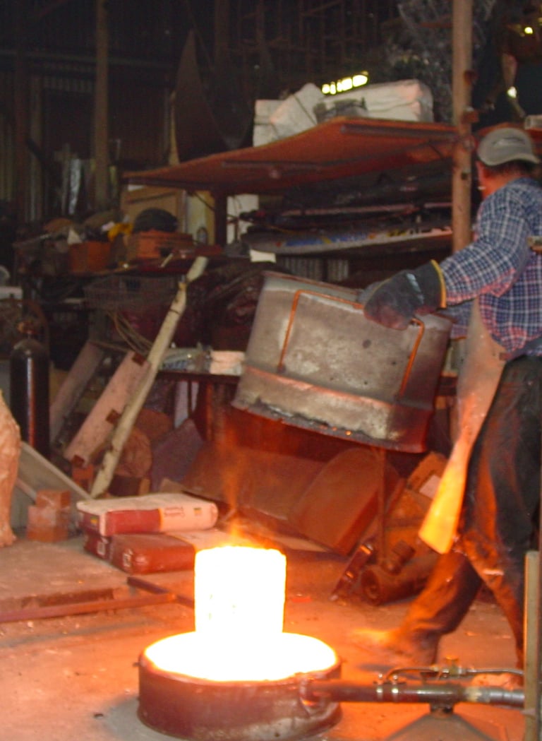 A glowing crucible full of bronze ready to pour