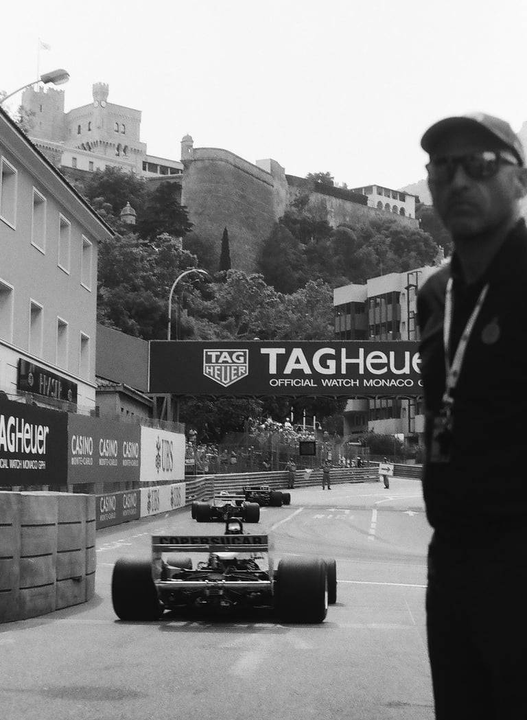 a race marshal watching the race cars get onto the circuit