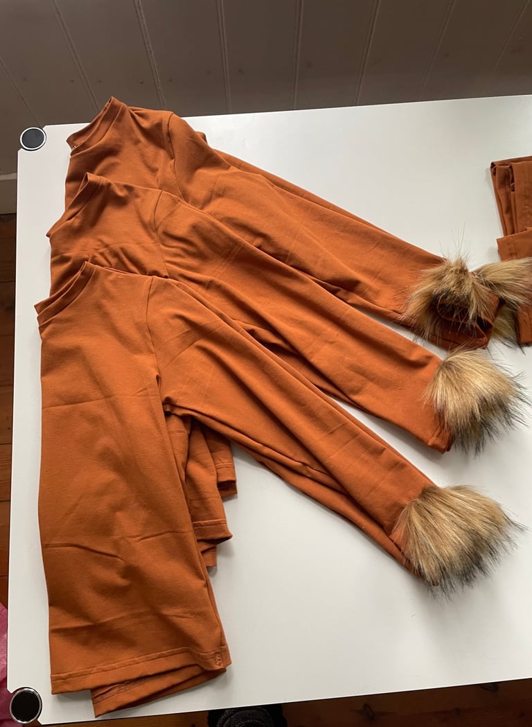 Lion long-sleeve shirts with faux fur cuffs.