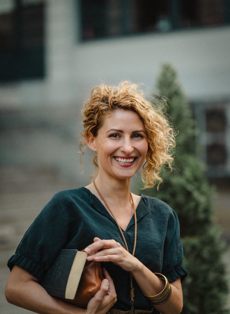 Valeria-Ivanova-PhD-smiling-holding-books