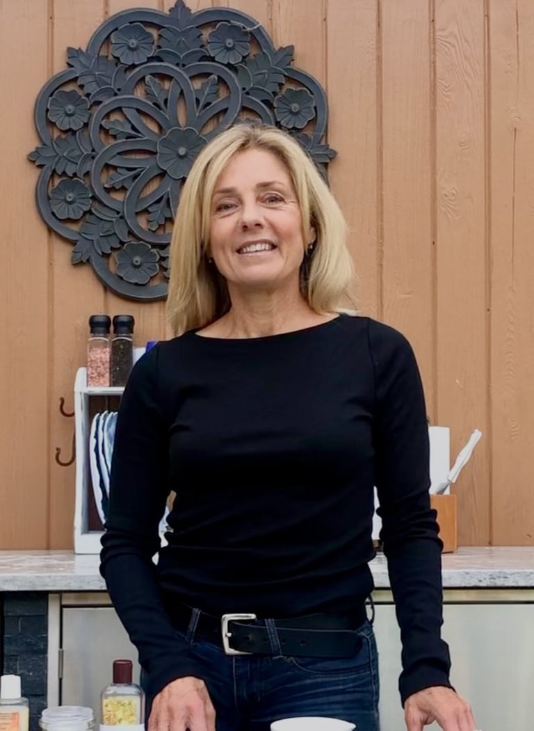 Woman standing in center of outdoor kitchen