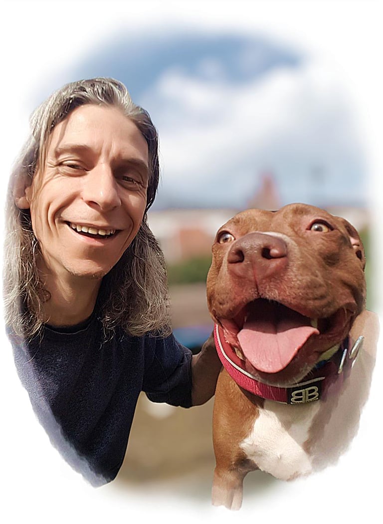 A dog trainer bonding with a happy dog in a circle.