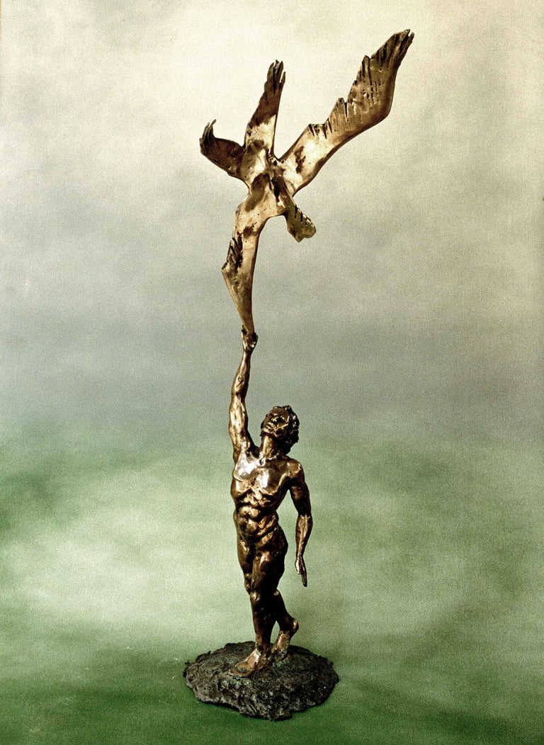 a bronze sculpture of a manreaching to touch a  bird's wing 