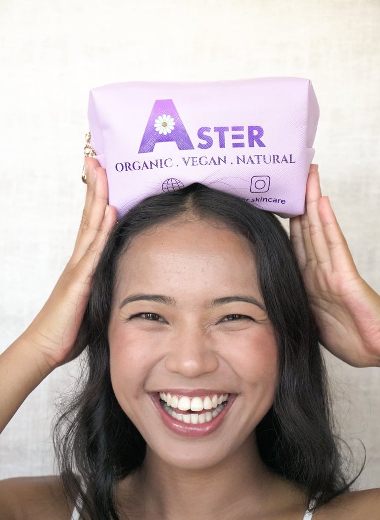 a very happy woman with Aster's purple pouchel bag on her head