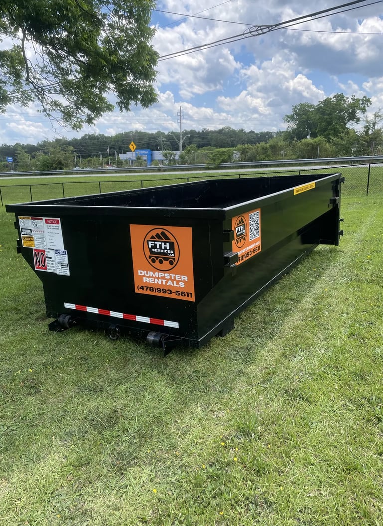 Dumpster rental in Forsyth, GA — roll-off placed in residential yard