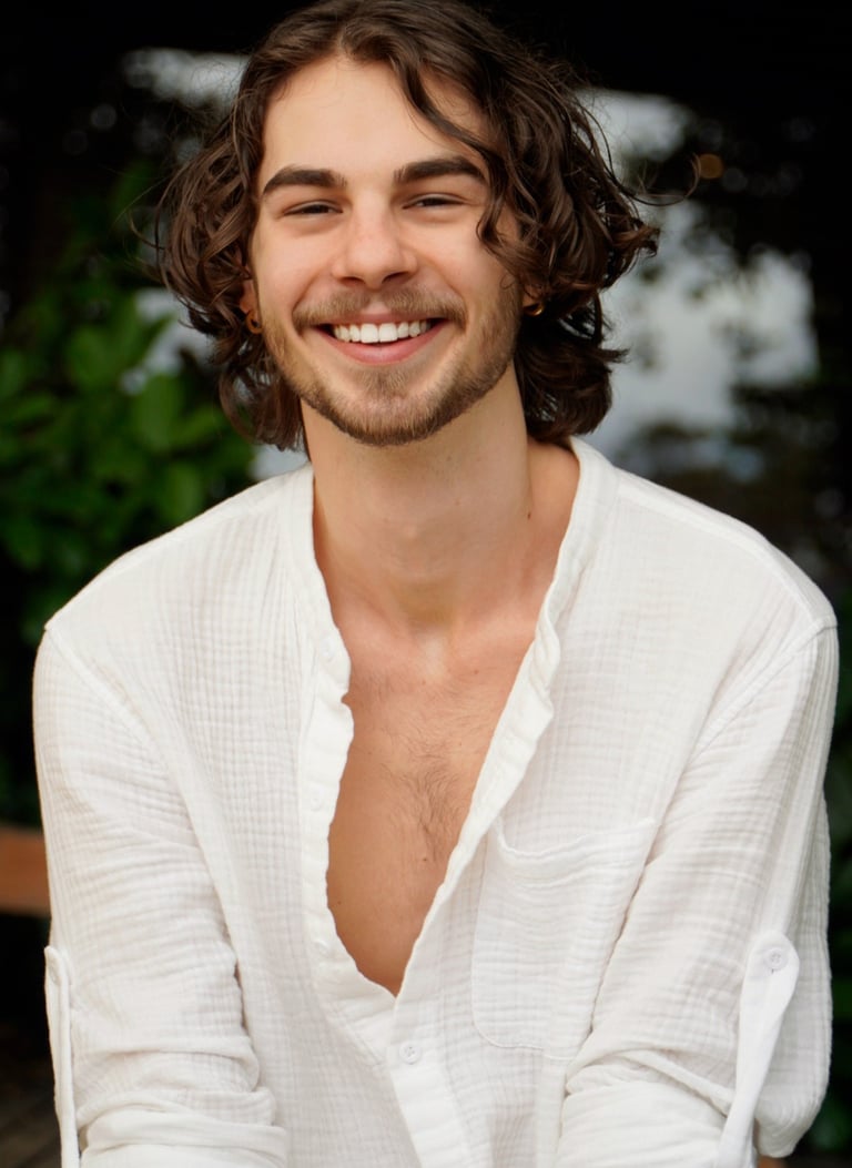 a man with a beard and a white shirt
