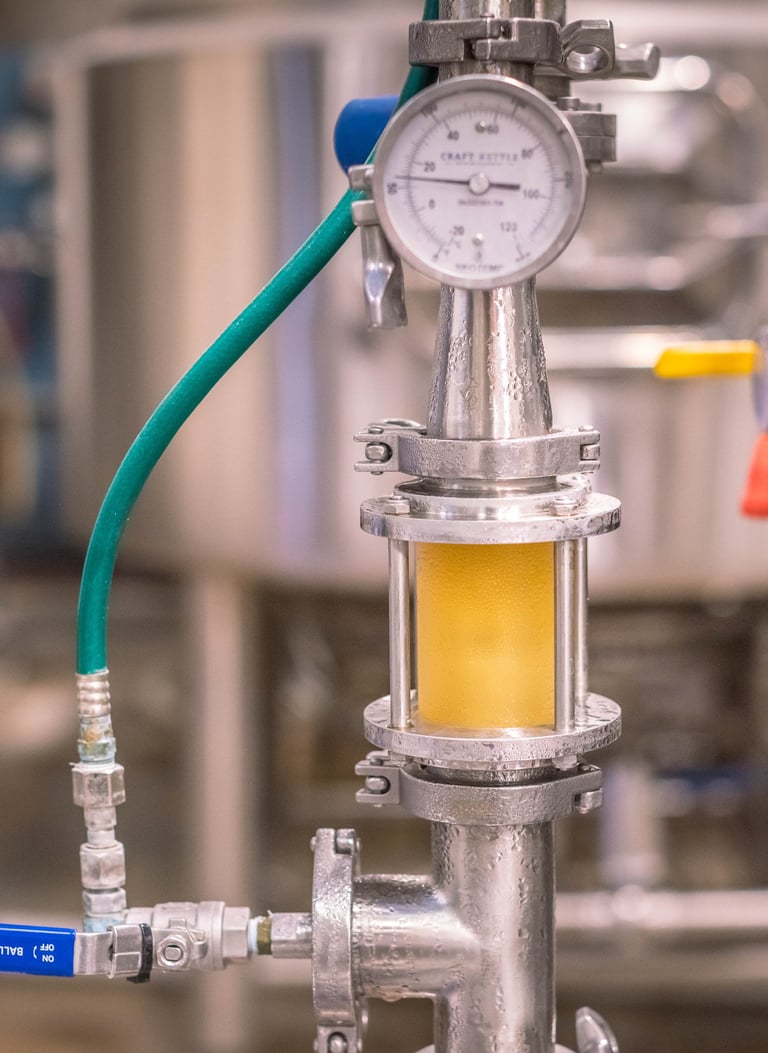 a beer pressure gauge gauged in a large metal tank