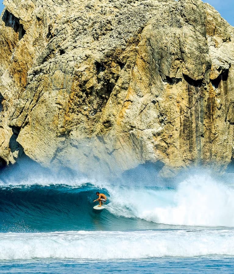 Surfing lessons at Witches Rock, Guanacaste, available with catamaran tour Costa Rica