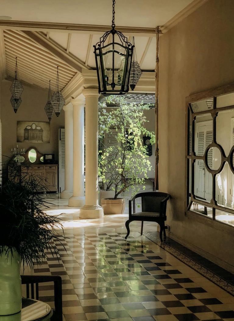 Traditional multi-generational estate gallery with checkered floors and upscale architectural detail