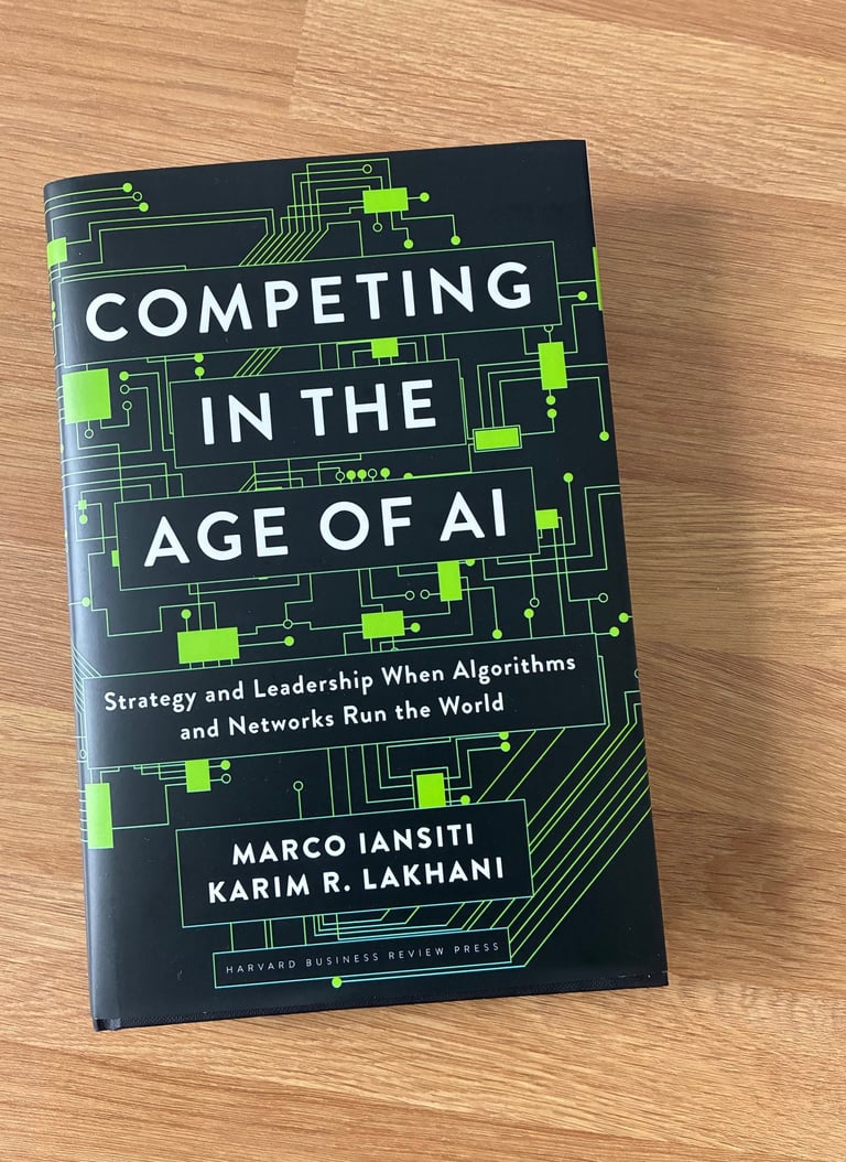 A phot of the book Competing in the age of AI