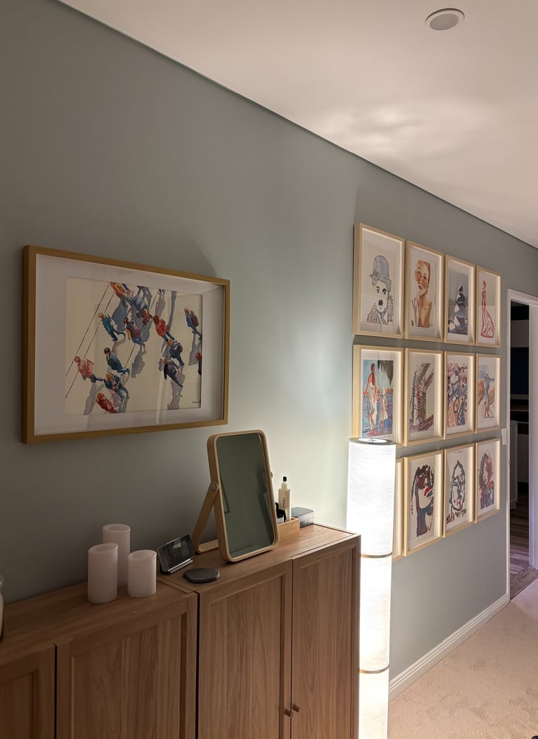 a salon hang showcasing multiple works by a single Artist
