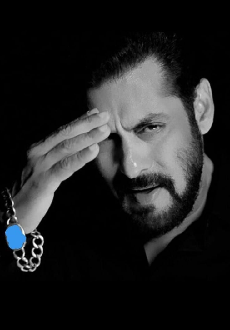 a man with a chain link bracelet and a chain link bracelet