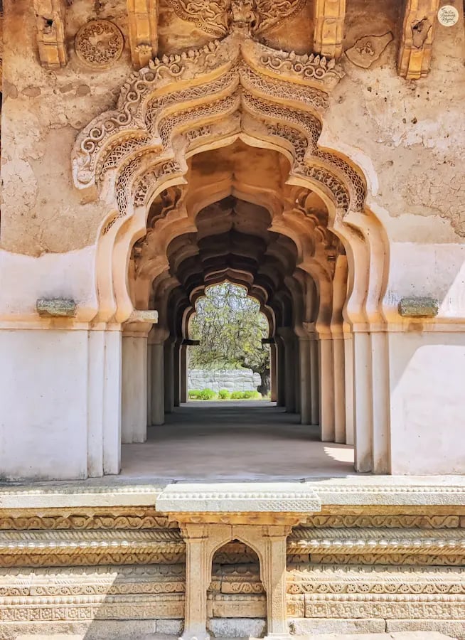 Lotus Mahal in Hampi with petal-shaped arches symbolizing timeless beauty.