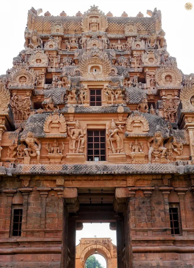 Ancient Chola stone carvings of figures at the entrance of Brihadeeswara Temple