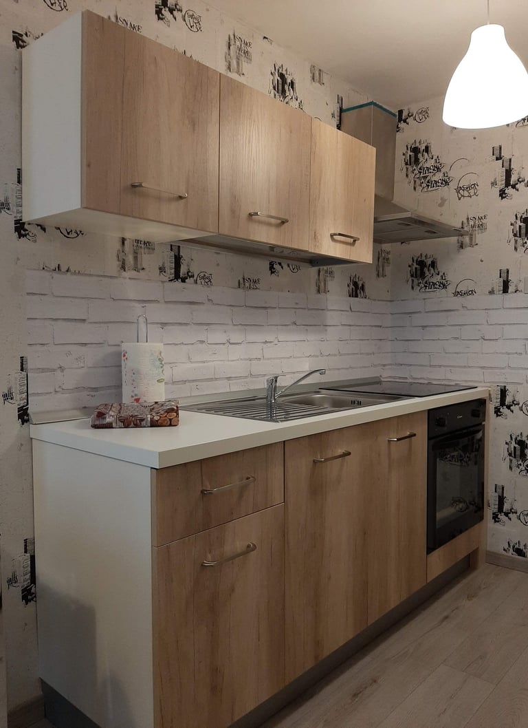 alt="cucina appartamento affitto val di Fassa"