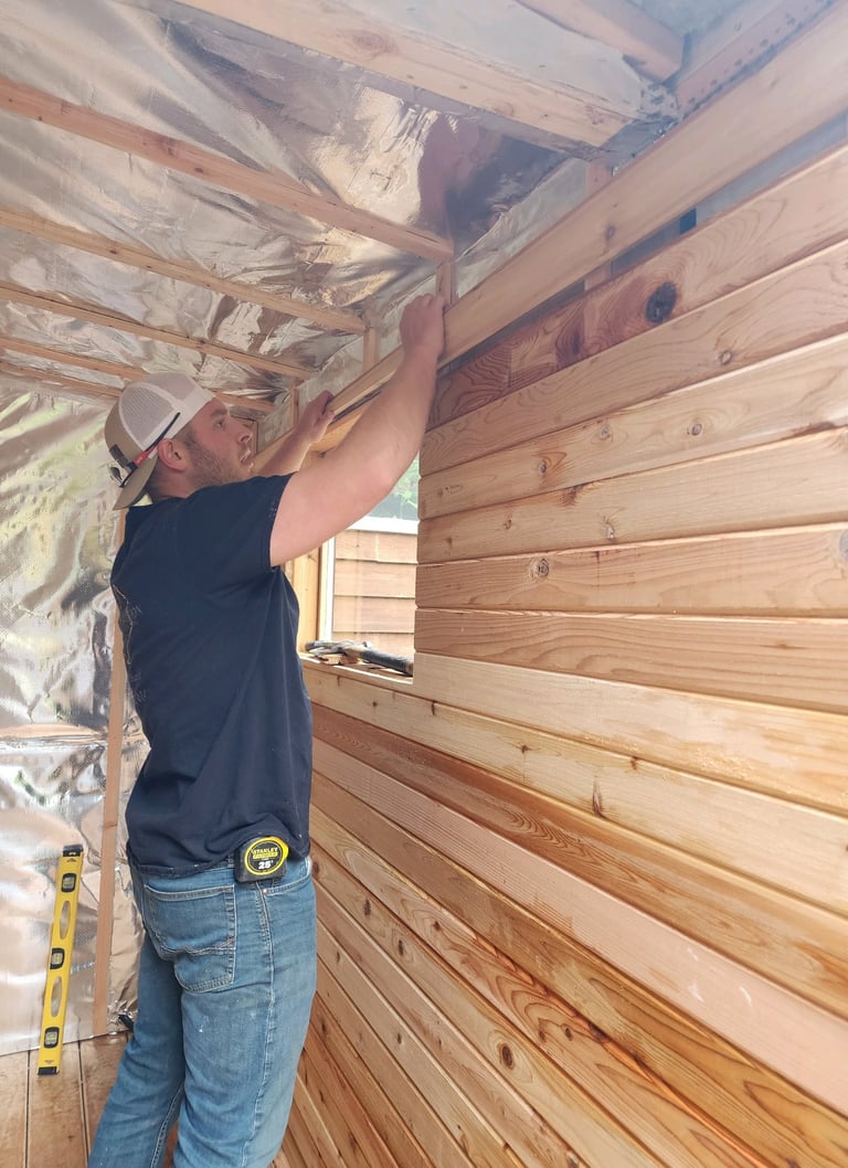 Logan working on cedar sauna