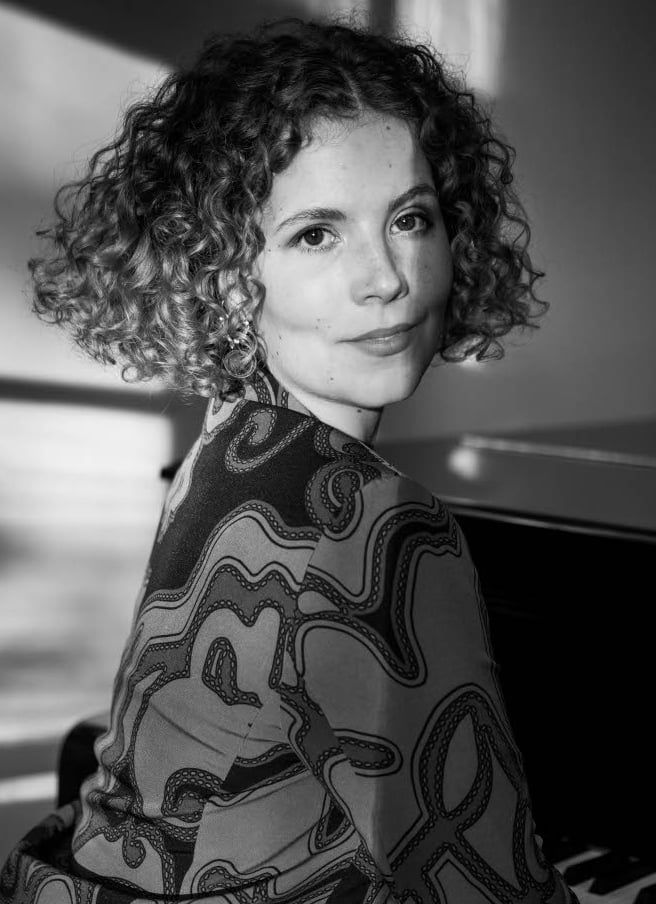 a woman iportrait and a piano
