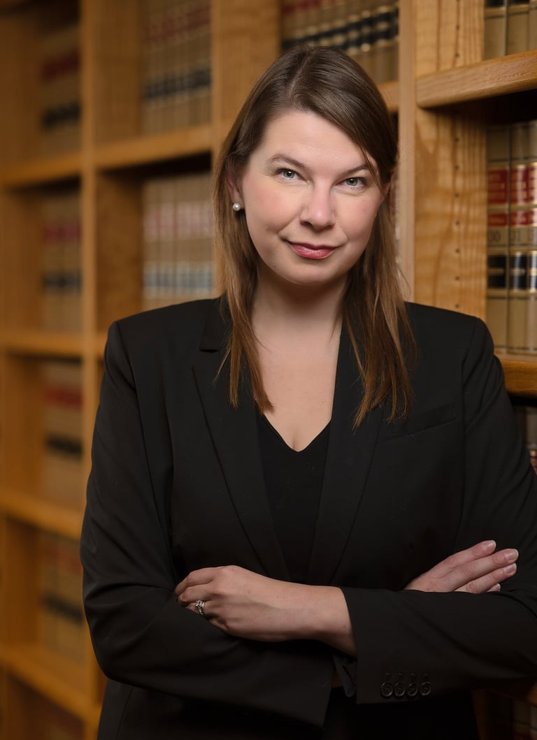 a woman in a suit and a suit jacket in a library