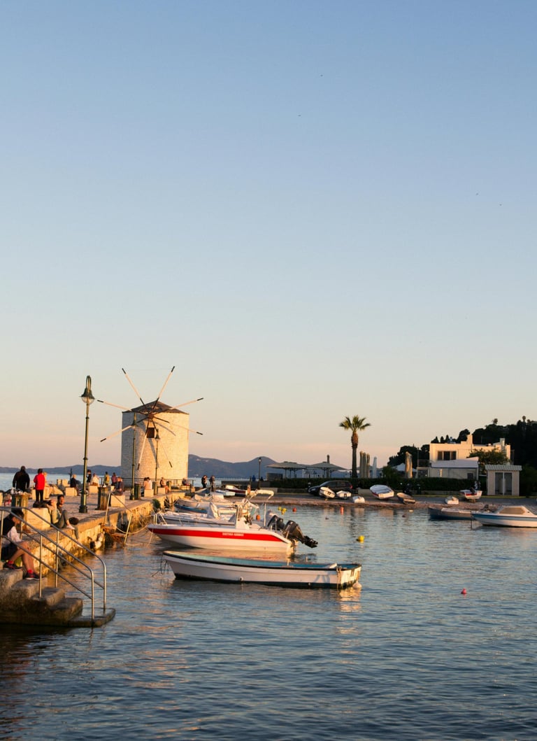 a boat is docked at a pier with people walking on the water