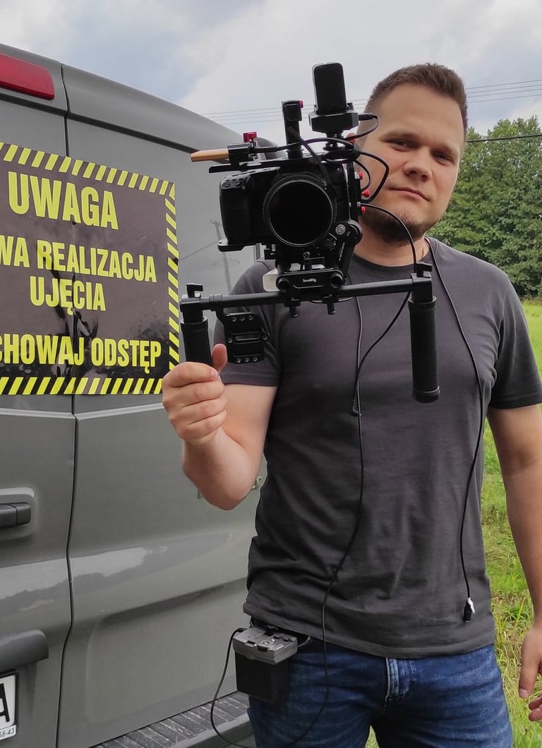 a man holding a camera and a camera