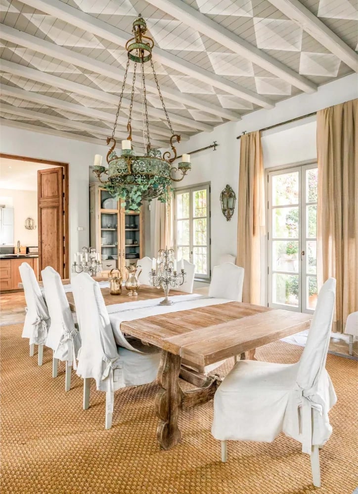 Bright dining room with wooden table and coffered ceiling