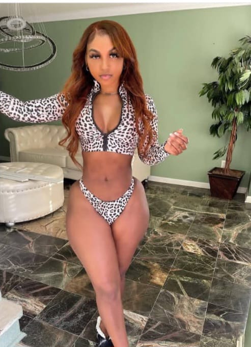 Experienced home massage therapist in Pattaya with a friendly and welcoming appearance, photographed in a night market