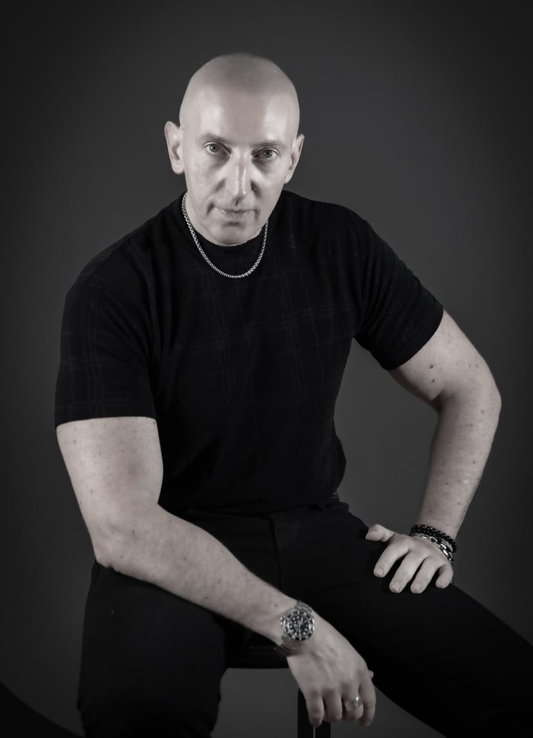 a man in a black shirt and a watch