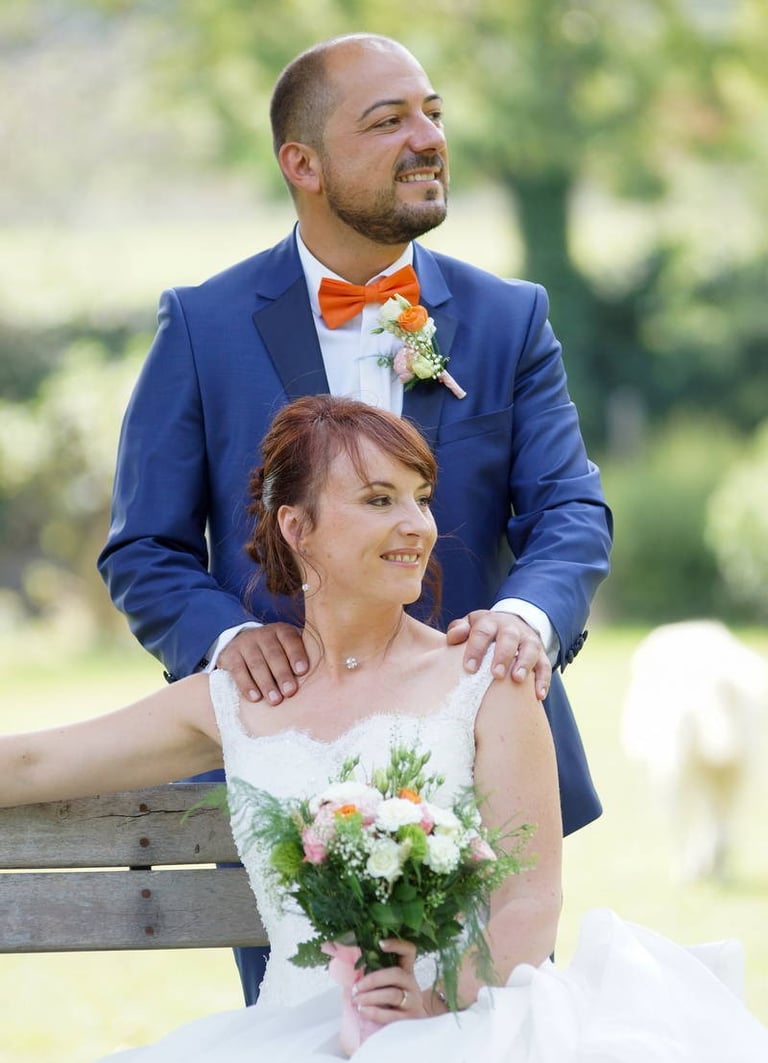 couple photography of bride and groom with flowers in burgundy