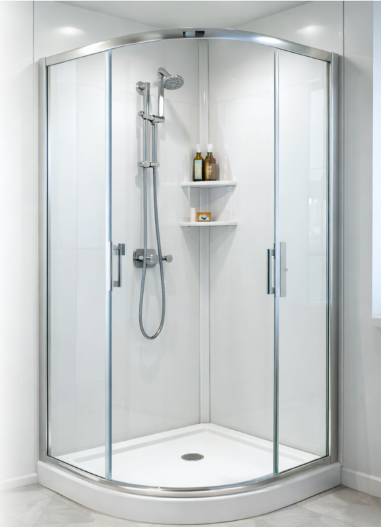 White acrylic shower enclosure with curved glass doors and bathroom shelves with toiletries
