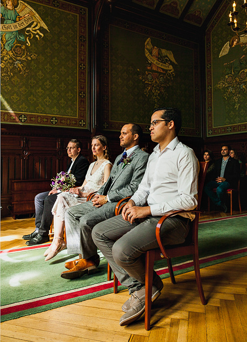 Bride, groom and two best men during a civil wedding ceremony.