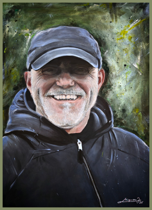 Acrylic portrait painting of a smiling bearded man wearing a baseball cap and black hoodie.