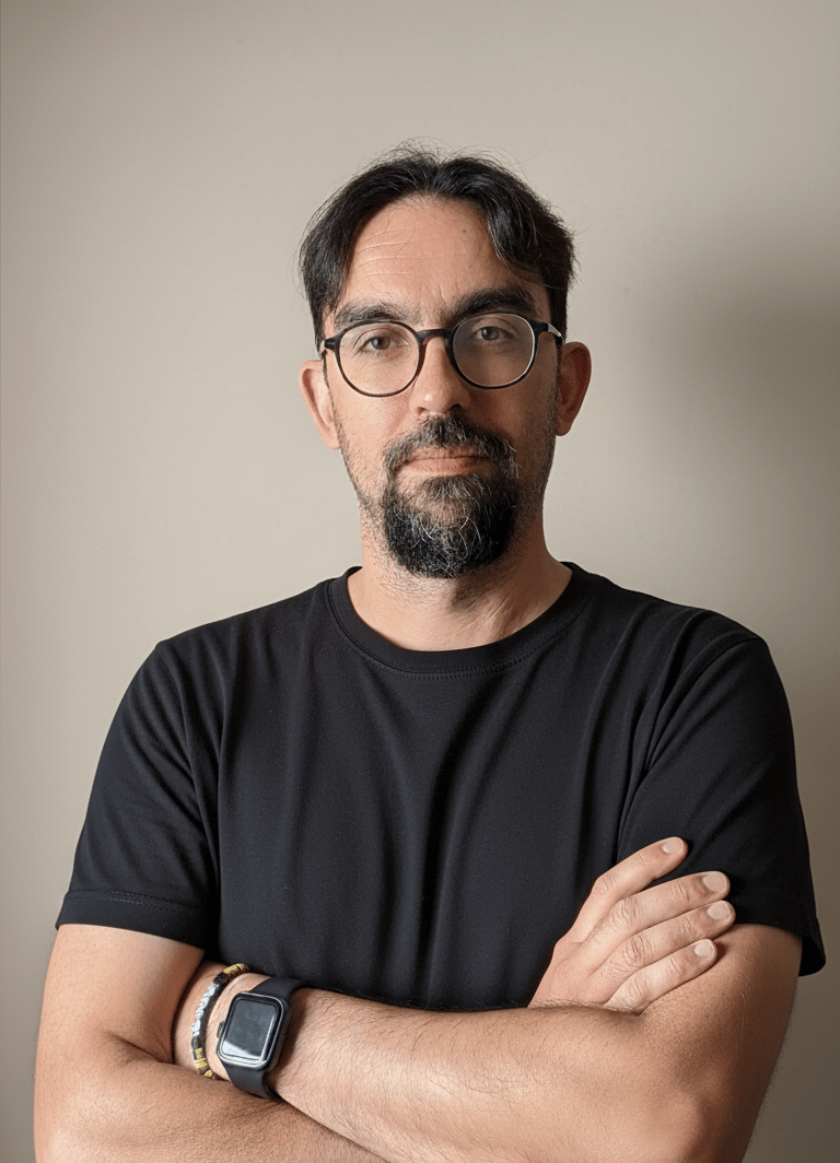 a man with glasses and a watch on his wrist