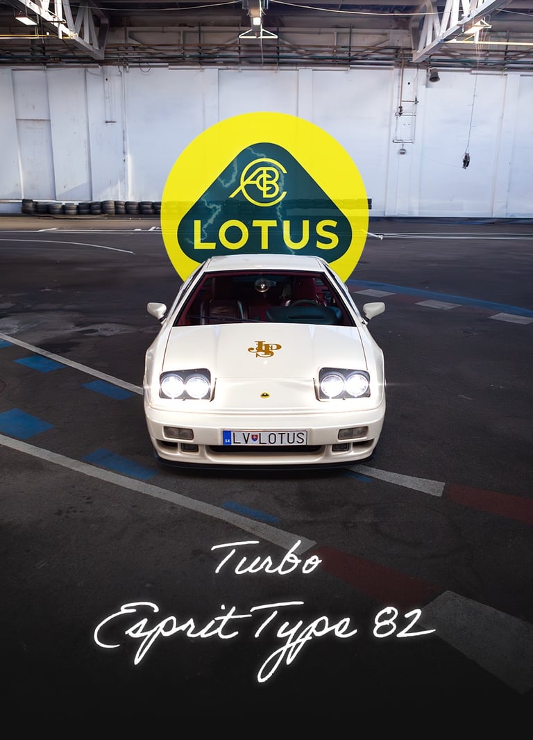 a white car with a lotus lotus logo on it