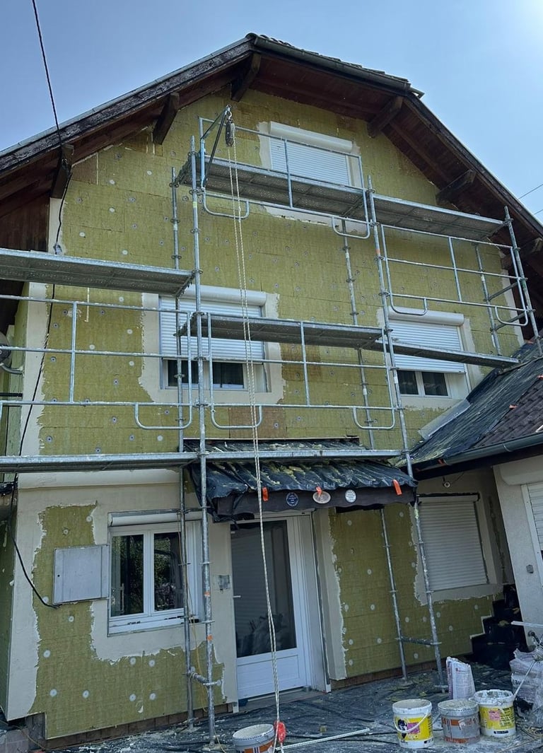 a house with a scafaffe on a scaffolded up to