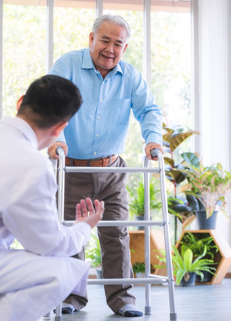 a Physiotherapist in a white shirt and a man in a blue shirt and a walker