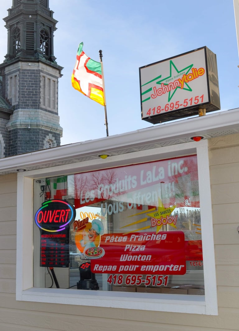 a restaurant with a clock tower in the background