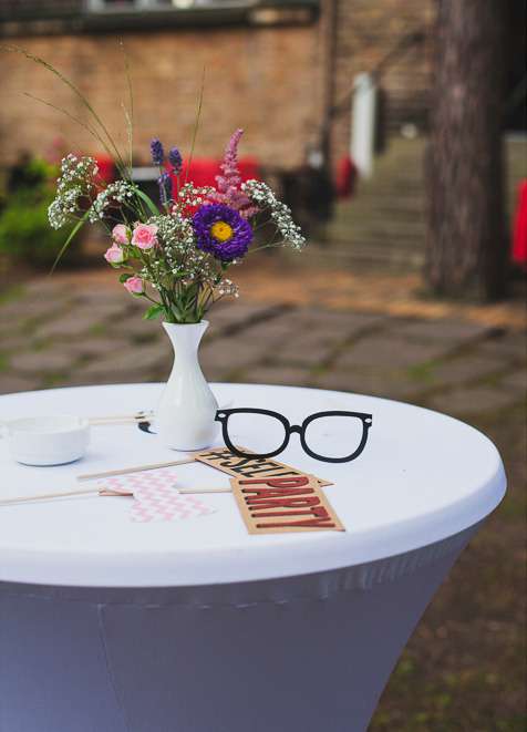 Table with photo booth accessories.