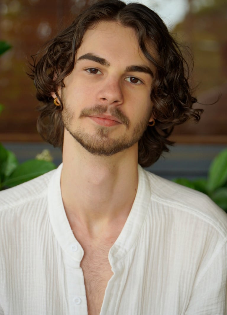 a man with a beard and a white shirt
