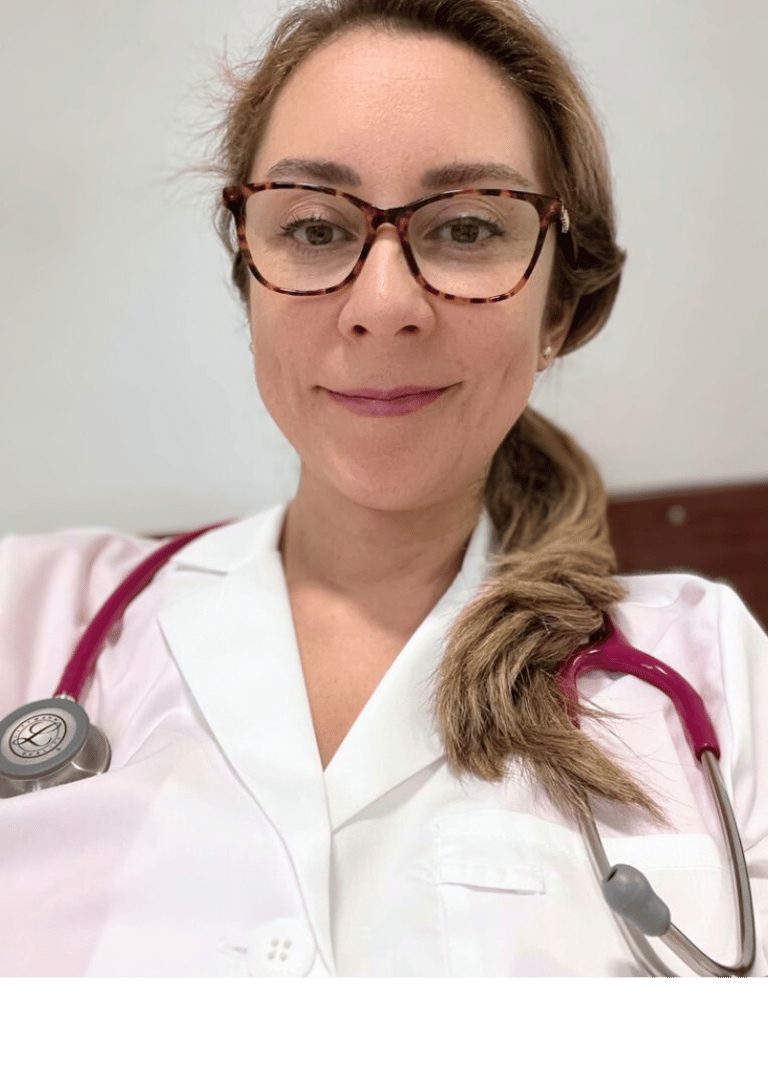 a woman in a white lab coat and glasses