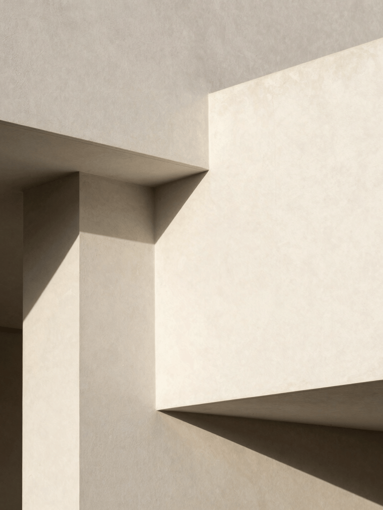 Clean architectural detail of a modern photography gallery in Spain with off-white textures and sharp artistic shadows, minimalist composition.