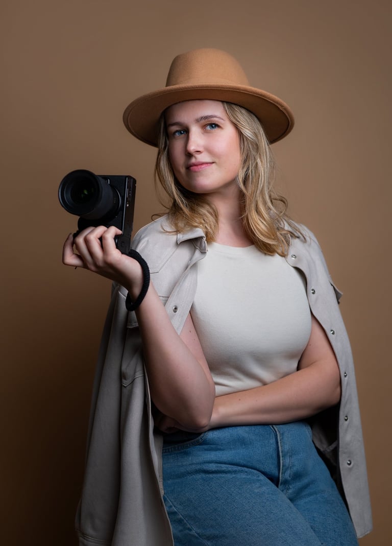a woman in a hat and a hat with a camera