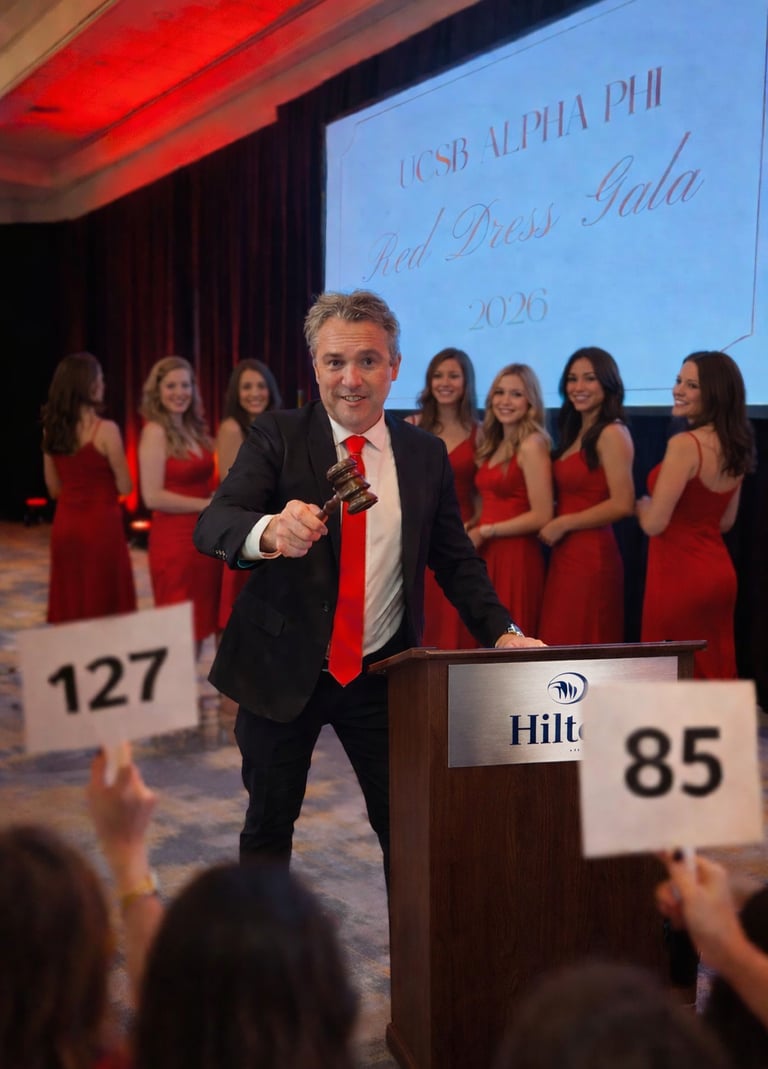Professional fundraising auctioneer Craig Rosevear using a gavel at the podium to take live bids fro