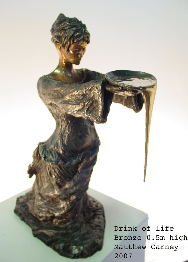 a statue of a woman holding a bowl of overflowing water